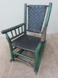 Rustic cabin porch rocker, painted green branch design nd reed seat