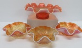 Four pieces of peach Carnival glass, Dugan