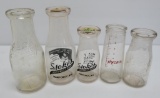 Five vintage milk bottles, pints and half pint
