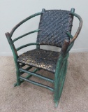 Rustic cabin rocker, painted green bent wood and reed seat
