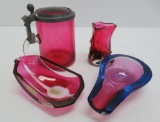 Four pieces of Modernistic cranberry glass