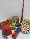 Nine vintage New Years noise makers and party hat candy contianer