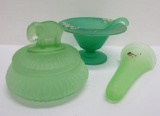 Three pieces of green vasoline and satin glass, elephant covered candy, wall pocket and condiment