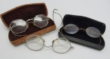 Three pair of vintage eye glasses with 2 cases