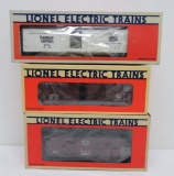 Three Lionel train cars with boxes, O gauge