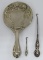 Nouveau style hand mirror and two German silver and sterling button hooks