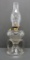 Patterned glass two handled oil lamp, 8 1/2