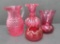 Four pieces of Cranberry glass, vase, bowl and pitchers