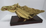 Brass horse head statue on wooden base, 24