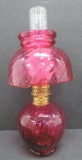 Cranberry miniature oil lamp with shade, 9