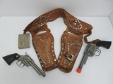 Roy Rogers and Trigger belt buckle and leather holster, two cap toys