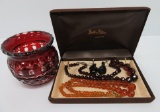 Costume jewelry with ruby cut to clear dresser jar