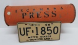 Escanaba Press metal newspaper container and 1966 Michigan license plate