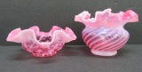 Two cranberry glass bowls, swirl and