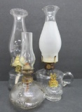 Four small and miniature oil lamps, 2 1/2