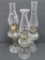 Three pattern glass oil lamps with chimneys, 8