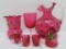 Assorted cranberry glass, pitcher, hand painted shaker, spooner and cordials