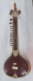 Sitar plucking string instrument used in Hindu classical music, 53
