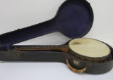Vintage Musketeer banjo with case, ornate back