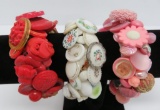 Three glass button bracelets, vintage button clusters on stretch bands, red, pink and white