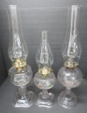 Three vintage oil lamps, patterned and hand painted floral