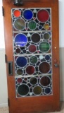 Large heavy leaded stained glass door, circle patterned leaded glass door