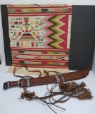 Ethnic sword in leather sheath and ethnic textile