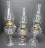 Three vintage oil lamps, about 8