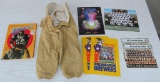 Sports lot with vintage child's football pants, Brewer and Packer items, linebacker book