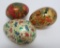 Three Kashmir eggs with stands, 3 1/2