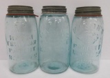 Three different blue Mason quart jars,