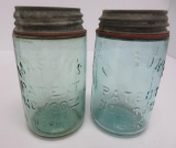 Two Mason 1858 pint jars, light green and aqua