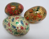 Three Kashmir eggs with stands, 3 1/2