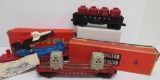 Three vintage Lionel O gauge train cars, Missile car, Energy Disposal and barrel & gondola car
