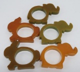 Five bakelite animal napkin rings, green and butterscotch, elephants and bunnies