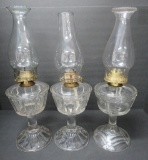 Three large patterned oil lamps, 9 1/2