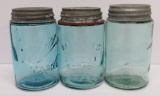 Three blue pint Mason jars, shoulderless, three styles