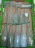 12 vintage soda and beer bottles, crown tops, clear, green and aqua