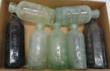 Seven Graf's Hutchinson bottles, amber, green, aqua, 6 1/4