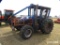 New Holland TB110 MFWD Tractor: Caged Cab, Forestry Pkg., Winch