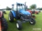 New Holland TS110 Tractor, s/n 170125B: 2wd, Encl. Cab, 2 Hyd. Remotes, Met