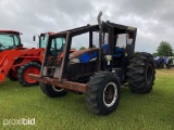 New Holland TB120 MFWD Tractor, s/n B86551M: Woods Boss 'Forestry Pkg., Cab