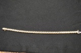 Gold (?) Tennis Bracelet W/ 42 Round Stones And Security Latch