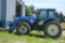 2002 New Holland Tm135 Mfwd Tractor With M646 Bush Hog Loader With Bucket,