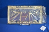 Pair Of 1961 Chevrolet License Plate Holders