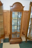 Dark Wood Display Cabinet w/ 4 Glass Shelves, on Riser, Arched Top, Lighted Inside, Mirrored Back