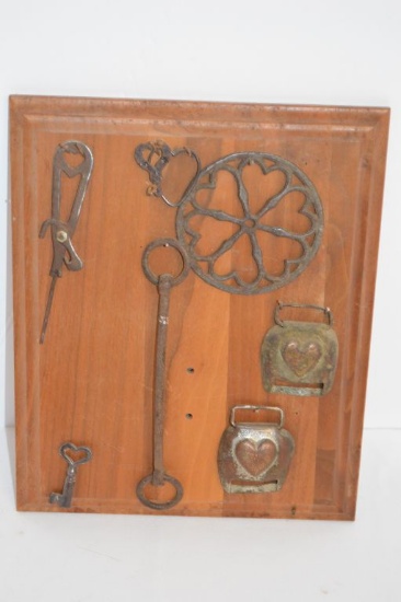 Display of Old Buckles, Bit, Key and Can Opener (?)