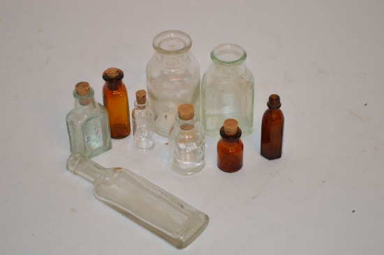 Group of 9 Small Bottles, some with Corks