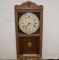 8 Day Calendar Clock in Wood Case w/ Pendulum and Key Lower Portion of Door