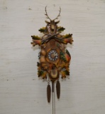 German Cuckoo Clock w/ Rabbit and Bird Hanging on Side, Satchel in the Cent